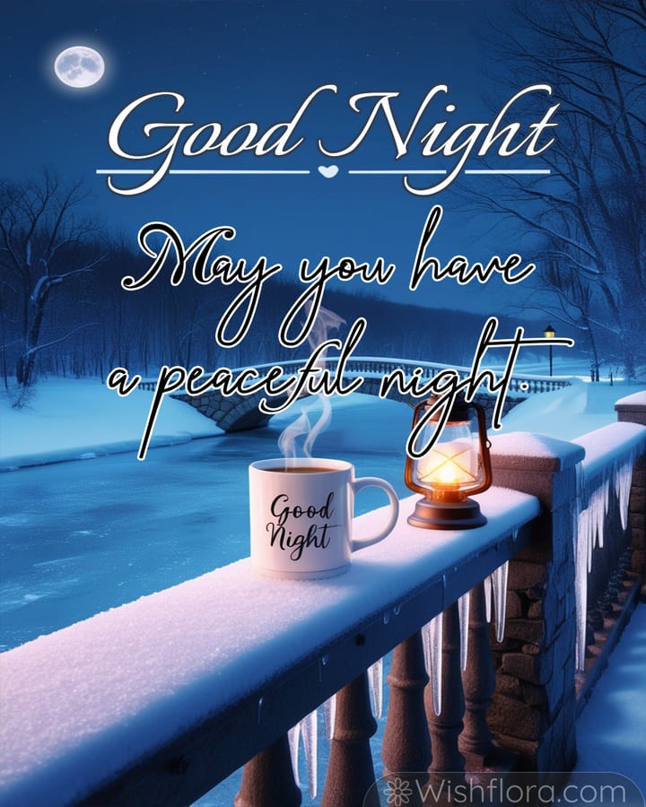 Peaceful Good Night Images of a snow-covered winter night with a steaming mug, glowing lantern, frozen river, icicles, and illuminated bridge.