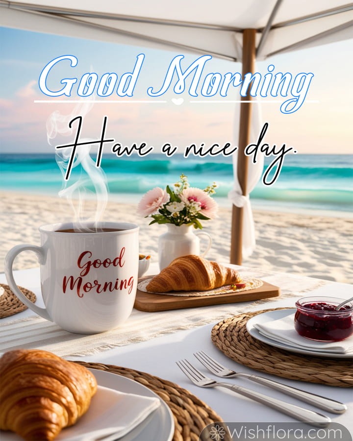 Good Morning Images of a tranquil beachside morning with a steaming mug, golden croissants, berry jam, daisies, and sparkling turquoise water under the sunlight, inspiring uplifting good morning blessings.