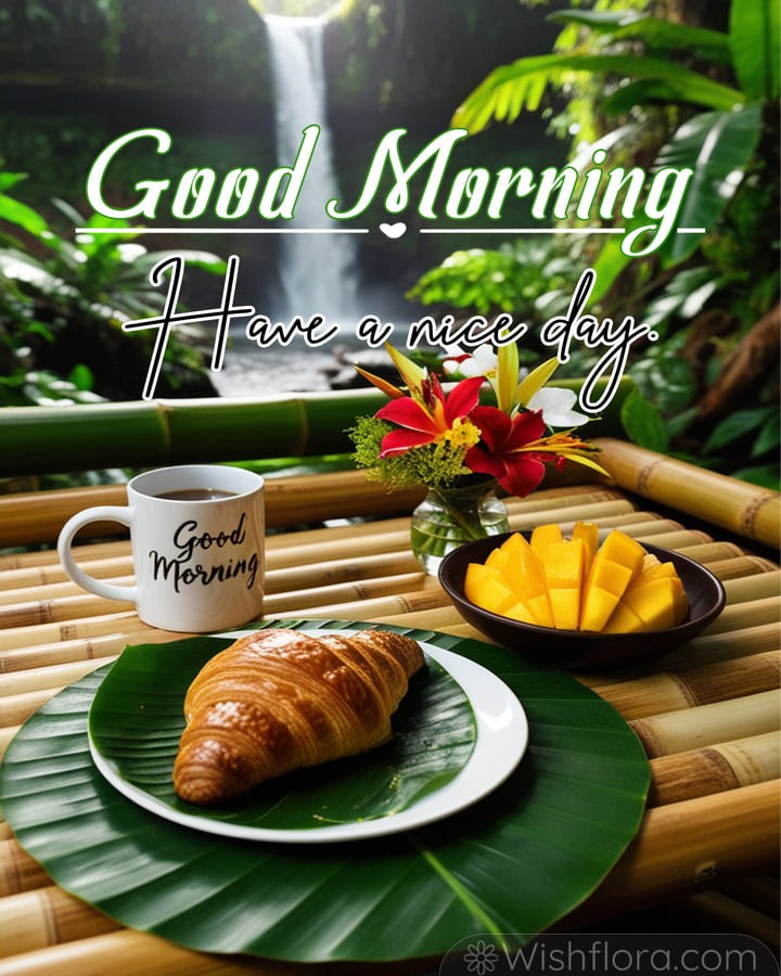 Vibrant Good Morning Images of a tropical retreat with a steaming mug, croissant on a banana leaf, sliced mango, exotic flowers, lush greenery, and a cascading waterfall, perfect for sharing joyful good morning blessings.